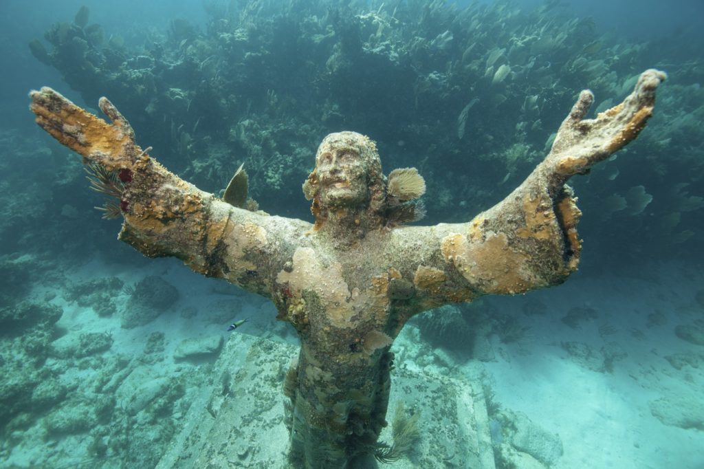 Arms raised heavenwards, the underwater Statue of Christ of the Abyss, Florida Keys National Marine